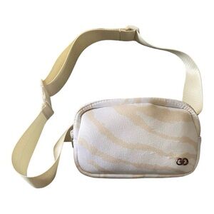 CALIA BY CARRIE UNDERWOOD 
White and cream color waist/belt bag